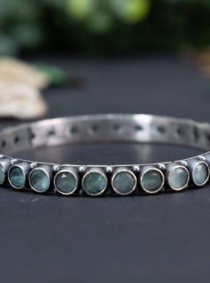 Oxidised bangle with mint green stones