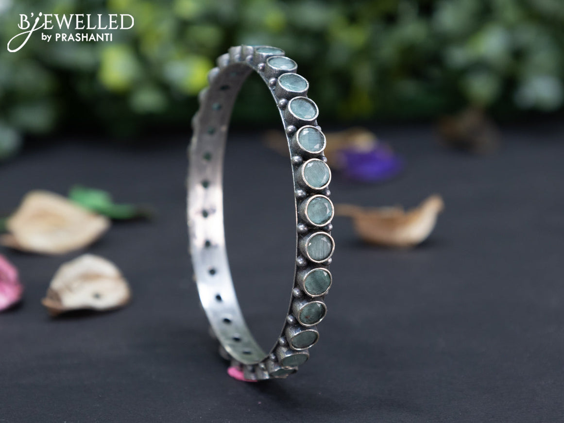 Oxidised bangle with mint green stones