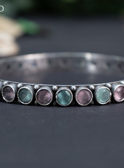 Oxidised bangle with mint green and baby pink stones