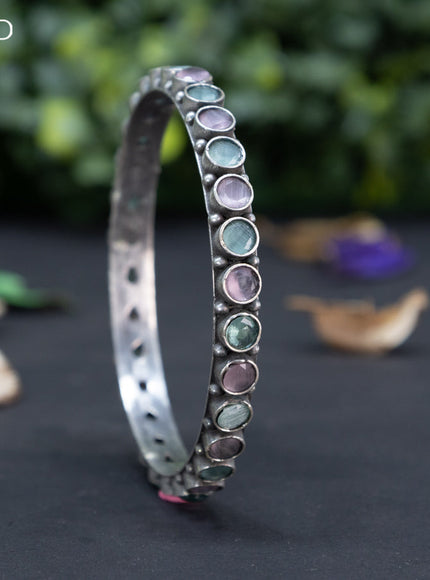 Oxidised bangle with mint green and baby pink stones