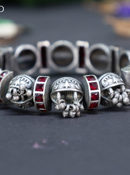 Oxidised screw type bangle with maroon stones and hanging