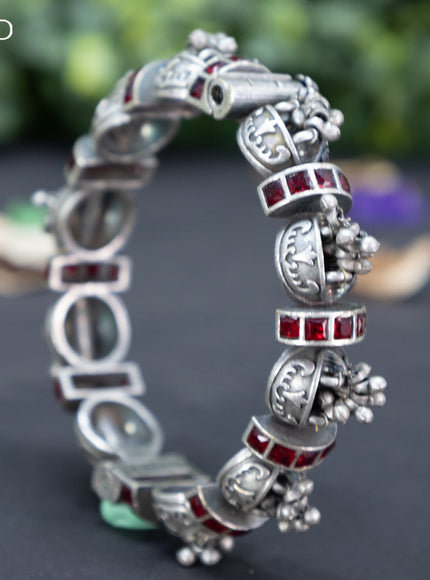 Oxidised screw type bangle with maroon stones and hanging