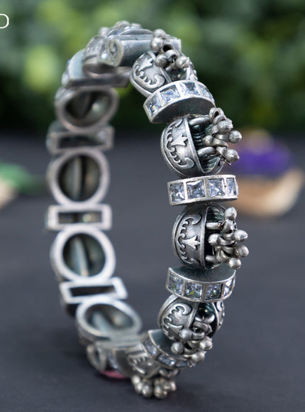 Oxidised screw type bangle with cz stones and hanging