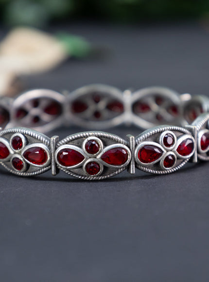 Oxidised screw type bangle with  maroon stones