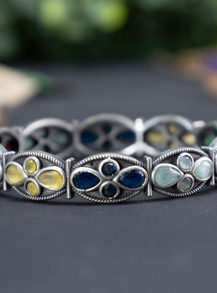 Oxidised screw type bangle with multi colour stones