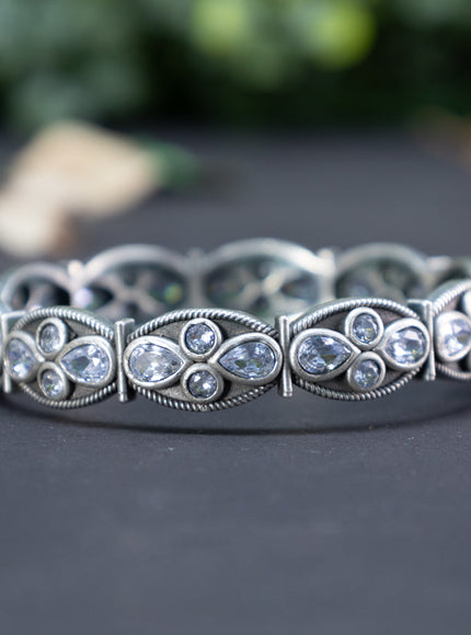 Oxidised screw type bangle with cz stones