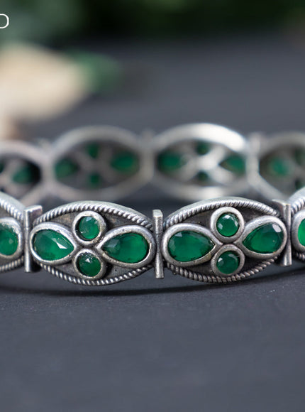 Oxidised screw type bangle with emerald stones