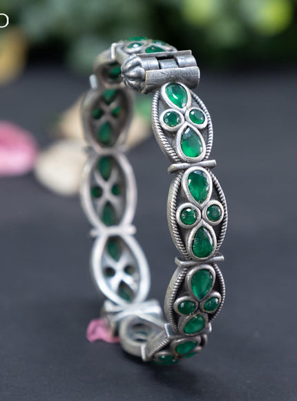 Oxidised screw type bangle with emerald stones