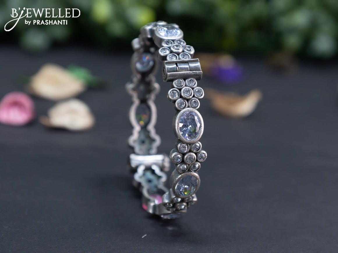 Oxidised floral design screw type bangle with cz stones