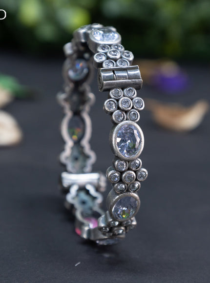 Oxidised floral design screw type bangle with cz stones