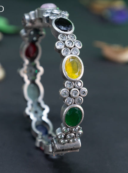 Oxidised floral design screw type bangle with multi colour stones