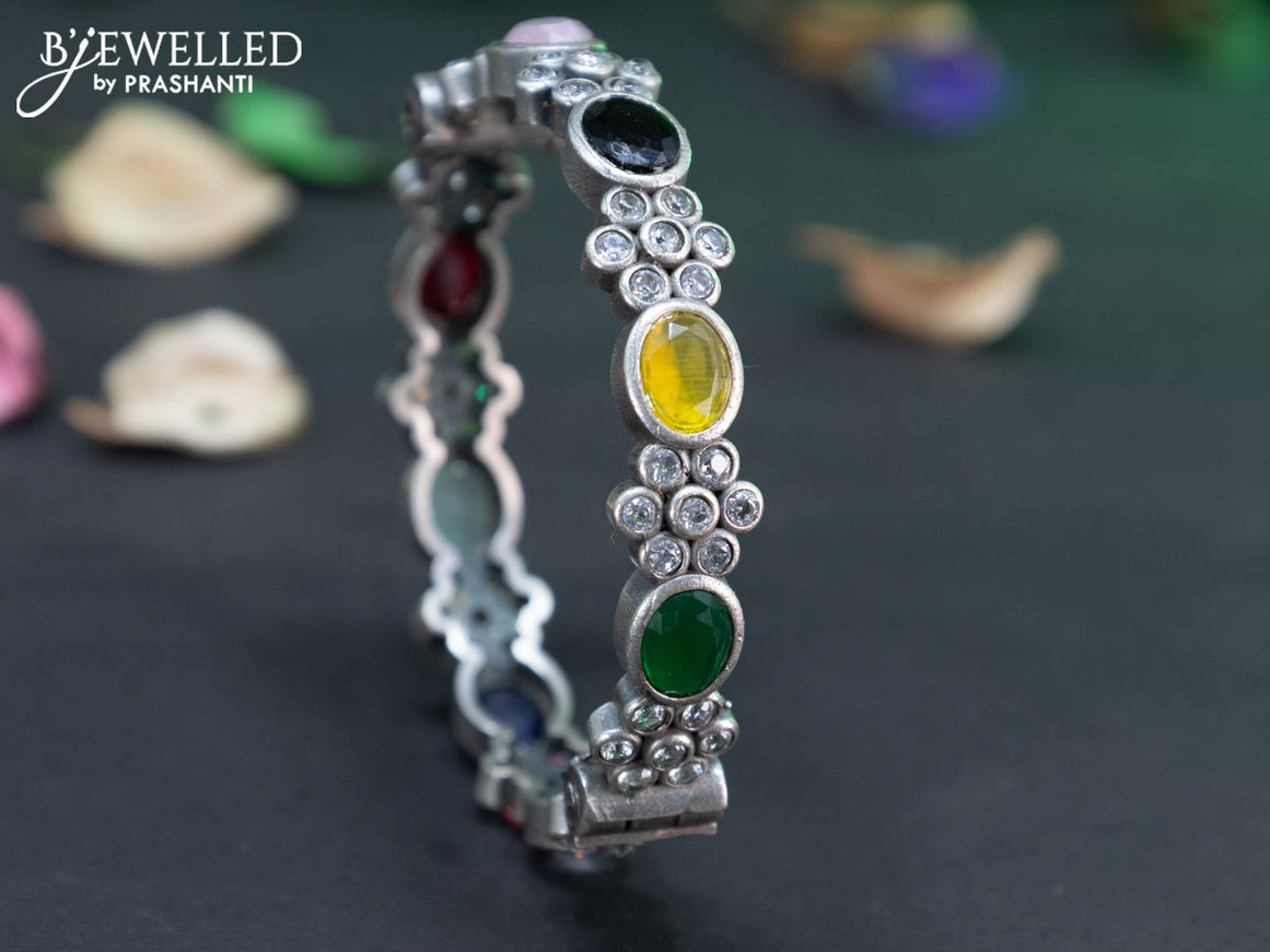 Oxidised floral design screw type bangle with multi colour stones