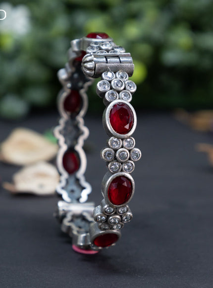 Oxidised floral design screw type bangle with ruby and cz stones