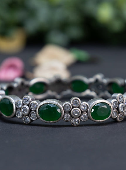 Oxidised floral design screw type bangle with emerald and cz stones