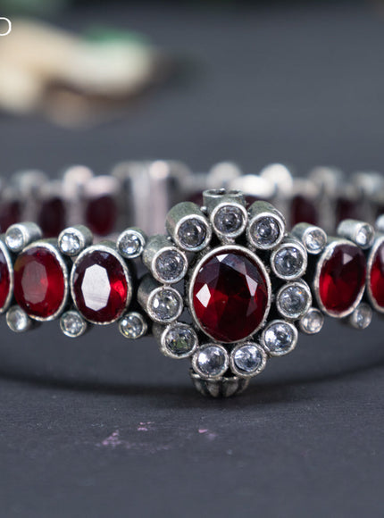 Oxidised screw type bangle with maroon and cz stones