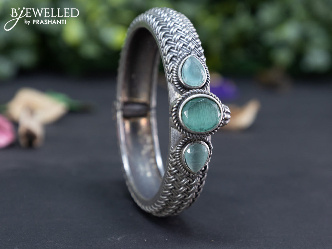 Oxidised screw type bangle with mint green stones