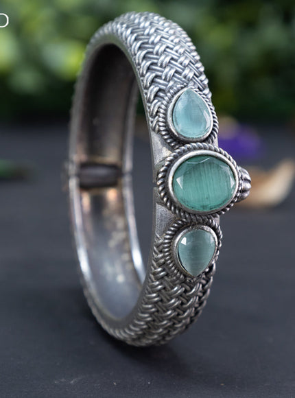 Oxidised screw type bangle with mint green stones