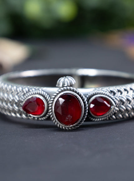 Oxidised screw type bangle with maroon stones