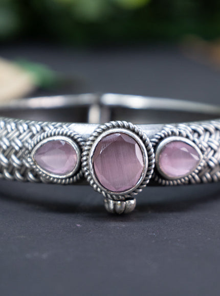 Oxidised screw type bangle with baby pink stones