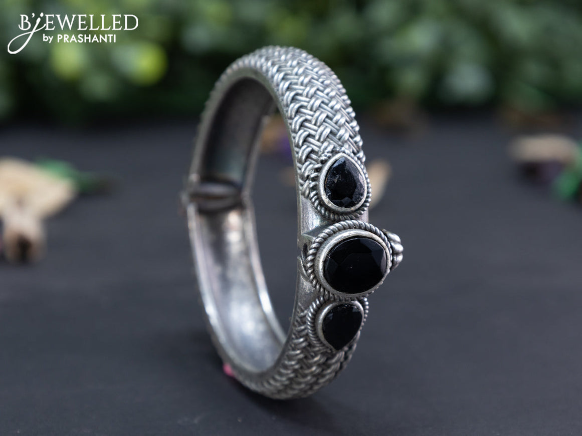 Oxidised screw type bangle with black stones