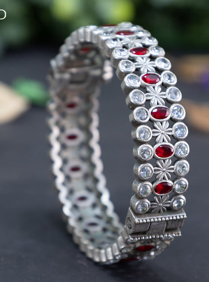 Oxidised screw type bangle with maroon and cz stones