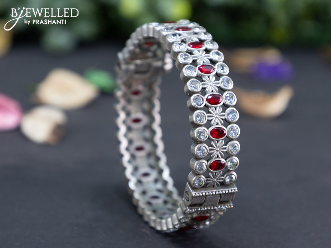 Oxidised screw type bangle with maroon and cz stones