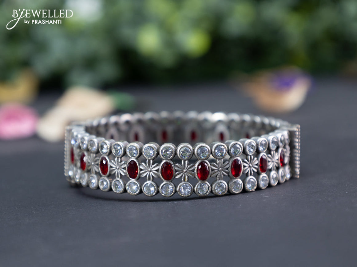 Oxidised screw type bangle with maroon and cz stones