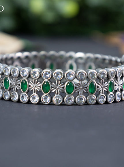 Oxidised screw type bangle with emerald and cz stones