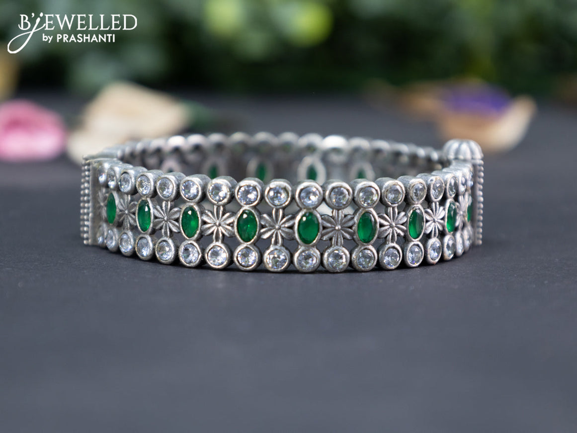 Oxidised screw type bangle with emerald and cz stones