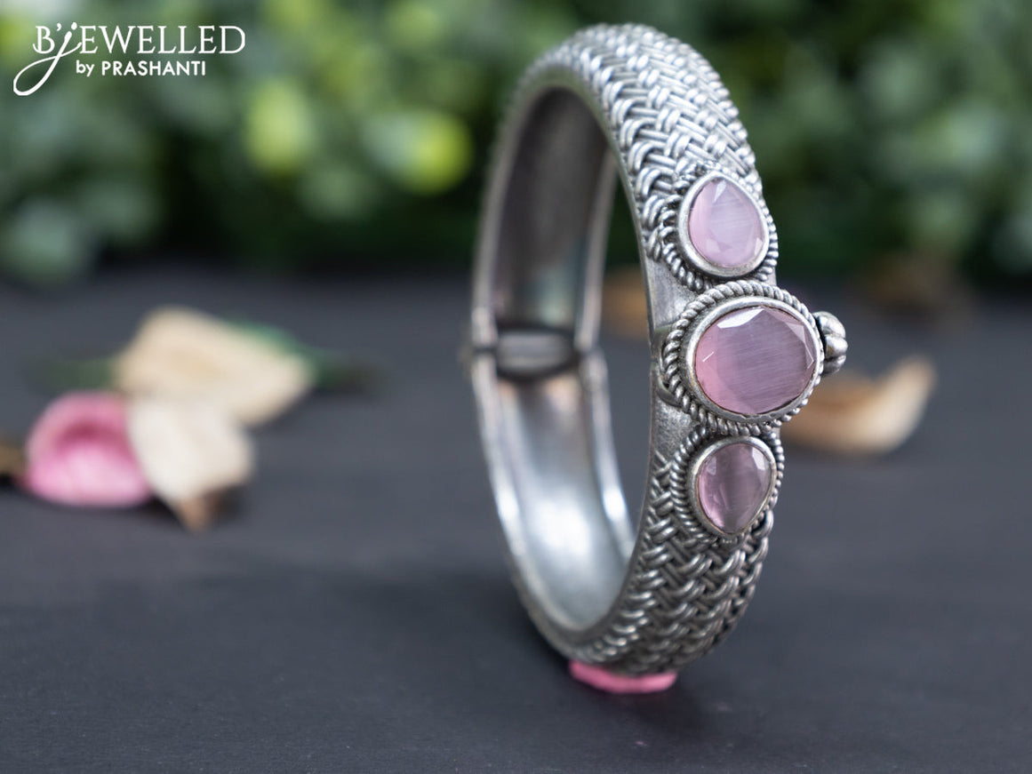 Oxidised screw type bangle with baby pink stones