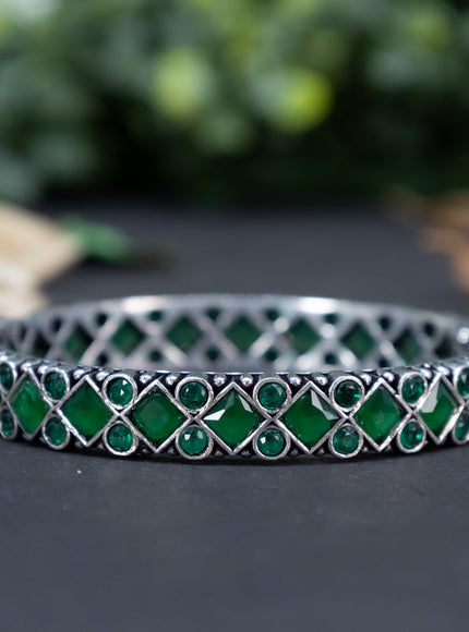 Oxidised bangle with emerald stones