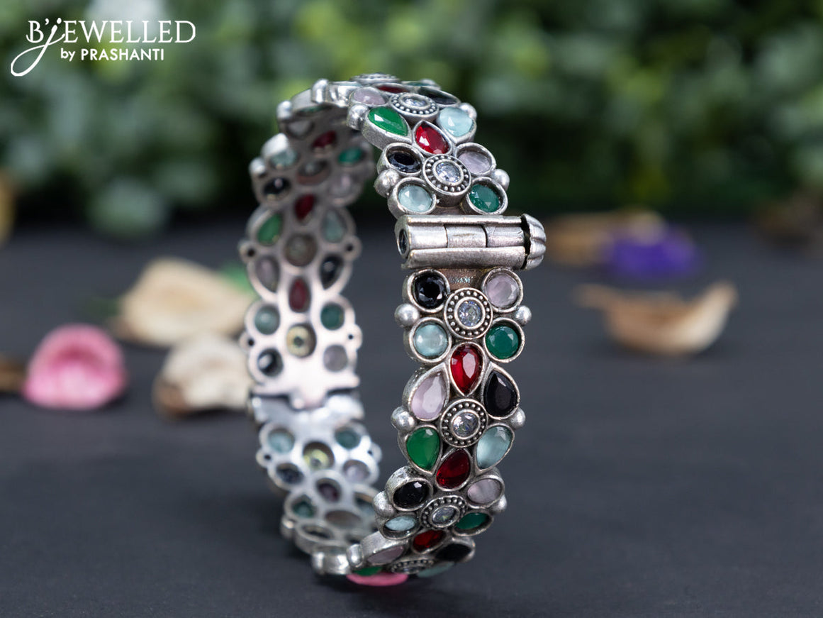 Oxidised floral design screw type bangle with multi colour stones