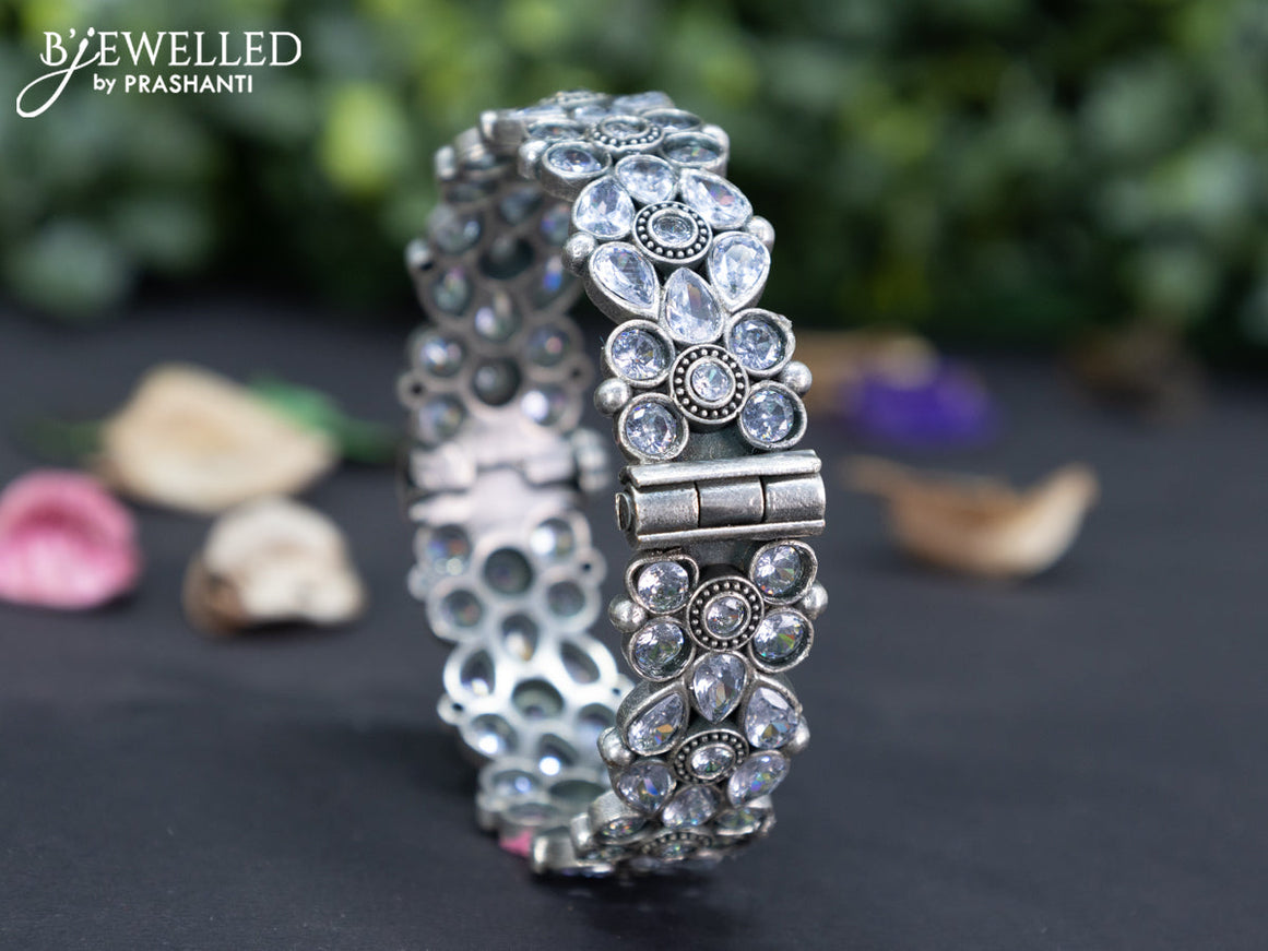 Oxidised floral design screw type bangle with cz stones