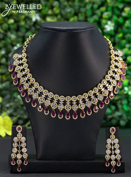 Zircon choker with ruby & cz stones and hangings in gold finish