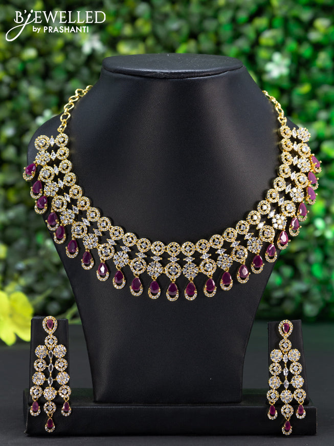 Zircon choker with ruby & cz stones and hangings in gold finish