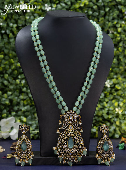 Beaded double layer mint green necklace with cz stones and beads hanging in victorian finish