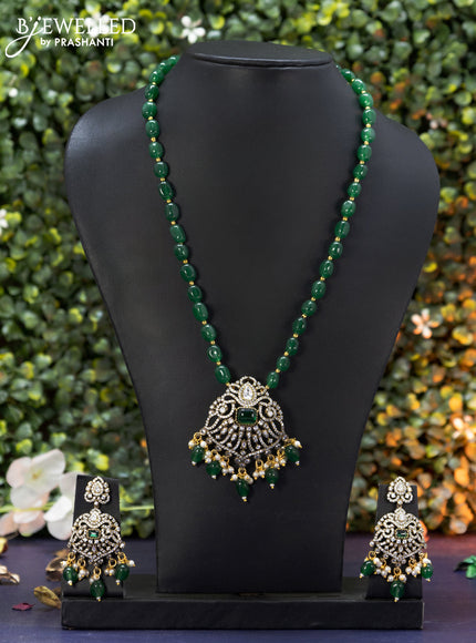 Beaded green necklace with emerald & cz stones and beads hanging in victorian finish