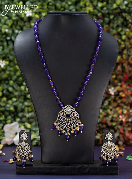 Beaded violet necklace with cz stones and beads hanging in victorian finish