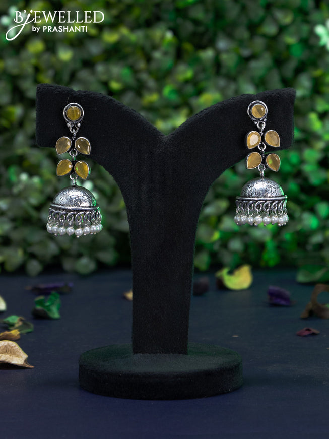 Oxidised jhumka with yellow stones and pearl hangings