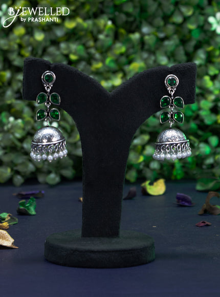 Oxidised jhumka with emerald stones and pearl hangings