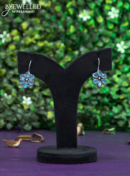 Oxidised hanging type earring with ice blue stones