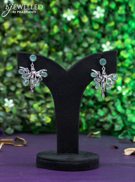 Oxidised earring butterfly design with mint green stones