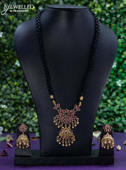 Black thread necklace with kemp stones and golden beads hangings