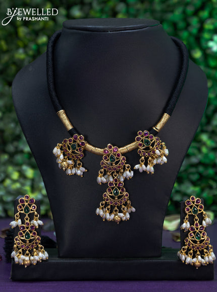 Black thread necklace with kemp stones & pearl and golden beads hangings