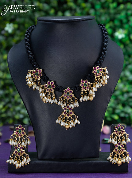 Black thread necklace with kemp stones & pearl and golden beads hangings