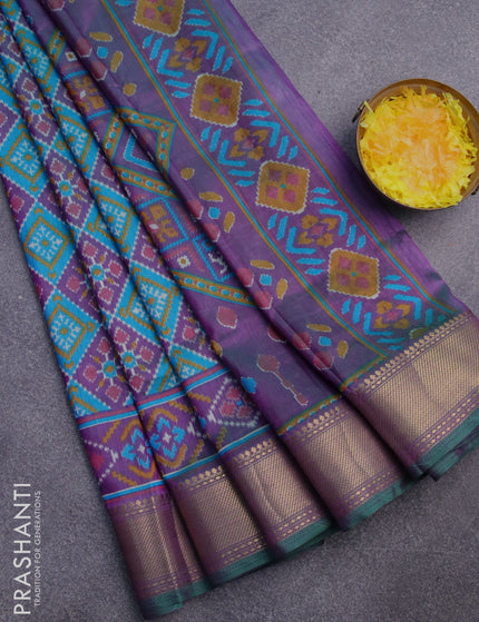 Semi tussar saree teal blue and dual shade of purple with allover ikat prints and zari woven border