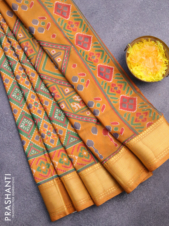 Semi tussar saree mustard yellow and green with allover ikat prints and zari woven border