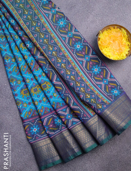 Semi tussar saree cs blue and dual shade of bluish green with allover ikat prints and zari woven border