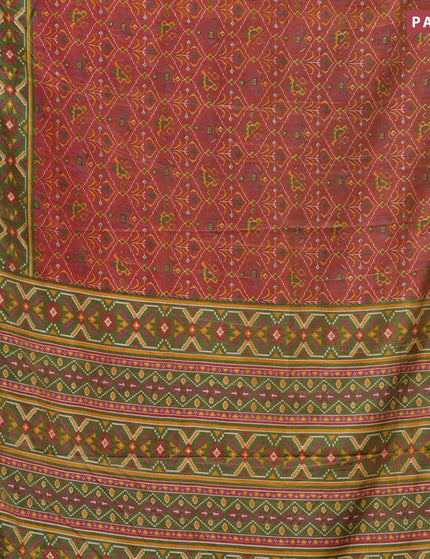 Semi tussar saree rust shade and green shade with allover ikat prints and zari woven border