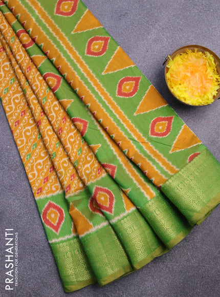 Semi tussar saree mustard yellow and green with allover ikat prints and zari woven border